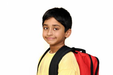 An handsome Indian kid getting ready for school clipart