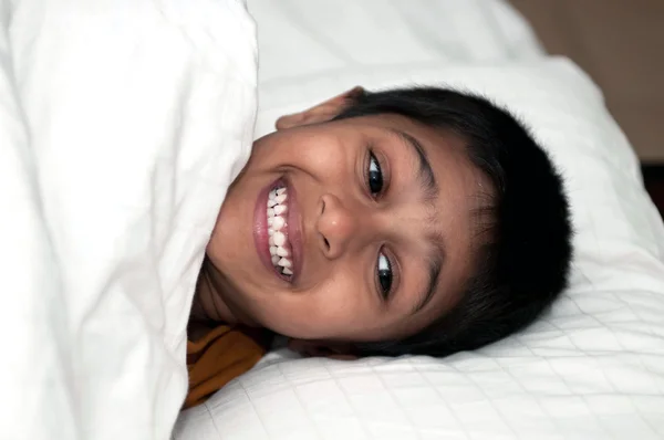 Handsome Indian Kid Lying Happily Bed — Stock Photo, Image