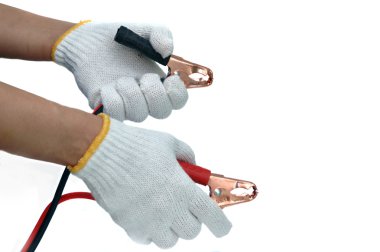 Hands and gloves with car jump start cables clipart