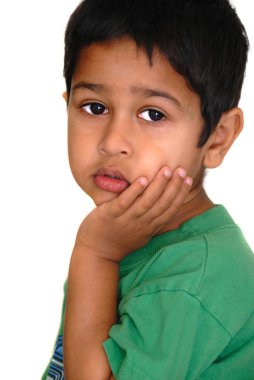 An handsome Indian kid looking very sad clipart