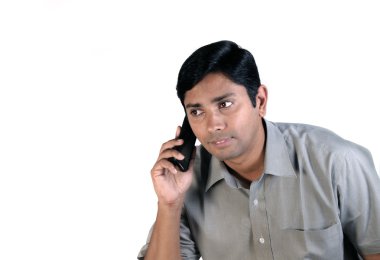 An handsome Indian businessman on call all the time clipart