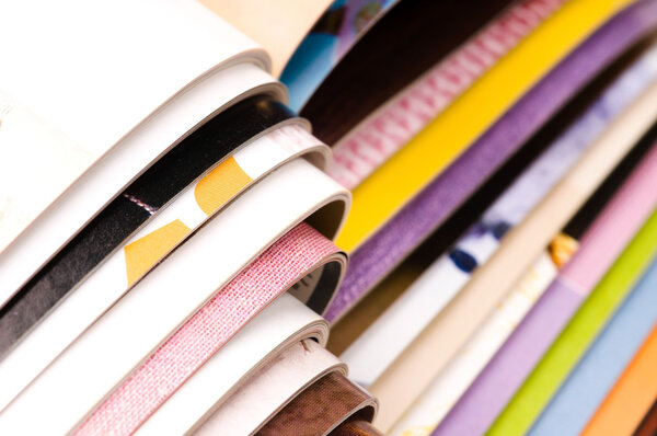 Stack of open magazines