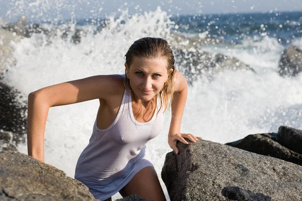 stock image Beautiful young woman comes out of the sea