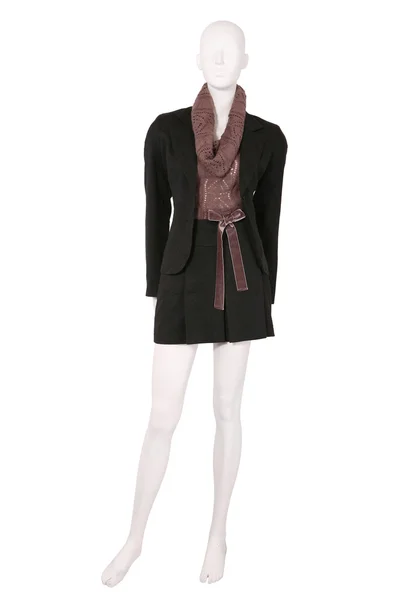 Etalagepop gekleed in een jas en rok — Stockfoto