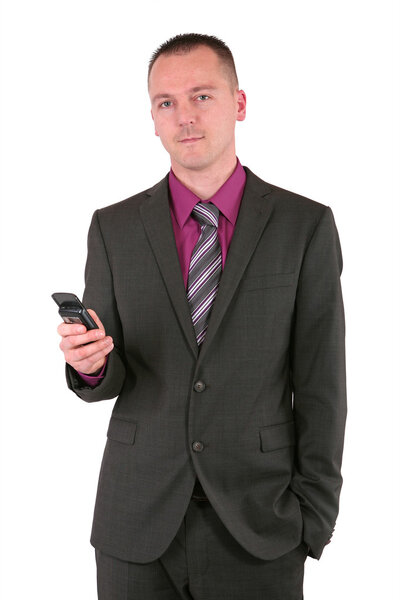Young businessman using a smart phone, isolated on white