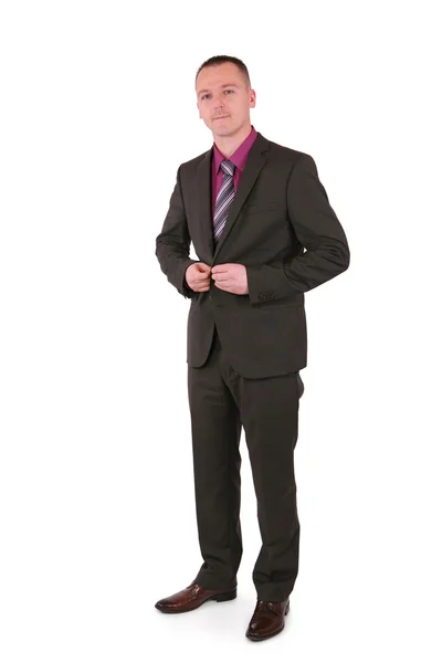 Businessman buttons up his jacket — Stock Photo, Image