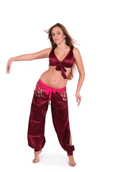 Beautiful young belly dancer in red costume Royalty Free Stock Photos