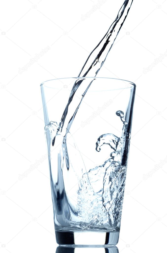 Pouring water into glass isolated on white background