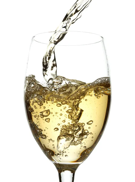 White wine pouring into glass Stock Picture