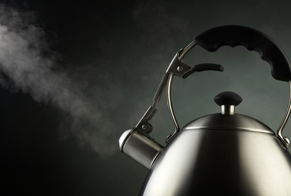 Tea kettle with boiling water