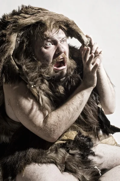 Caveman in bear skin — Stock Photo, Image