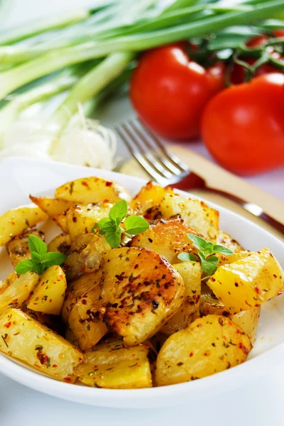Well spiced roasted potato slices — Stock Photo, Image