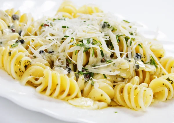 Italian pasta with cheese and herbs Stock Image