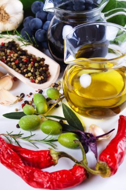 Olive oil with spices and food ingredients clipart