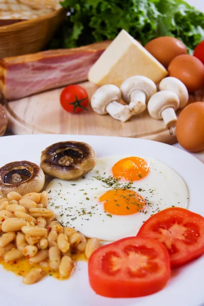 Fried eggs with beans and mushrooms — Stock Photo, Image