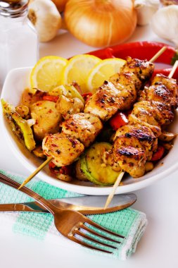 Grilled chicken meat on skewer clipart