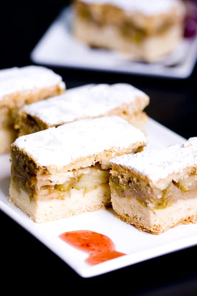 Stock image Homemade apple sponge cakes with cinnamon on the white plate