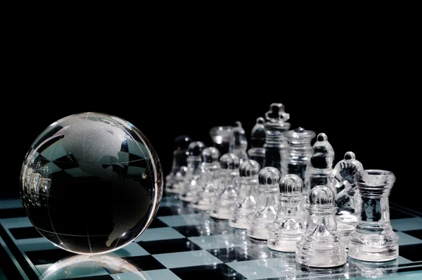 Crystal Chess Pieces Row Globe Black Background — Stock Photo, Image