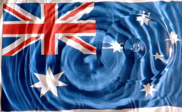 素敵なサークルと波紋水の下でオーストラリアの国旗 — ストック写真