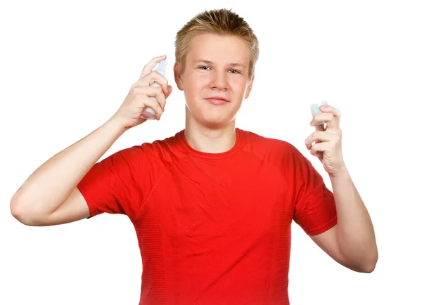 The boy, the teenager with a cream for a problem youthful skin, against spo — Stock Photo, Image