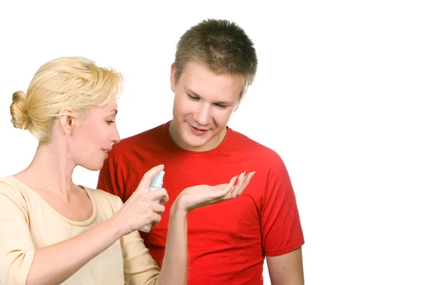 The girl tells to the teenager how to use a cream against spots — Stock Photo, Image