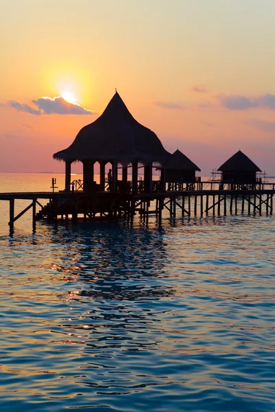 Island in ocean, Maldives. Sunset.