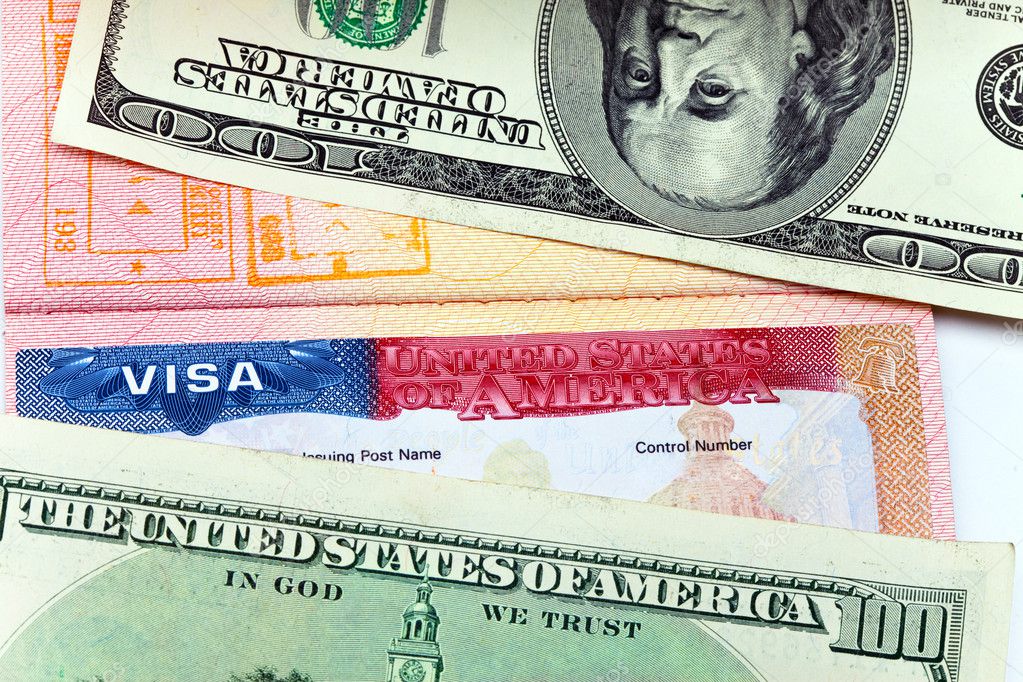 The American visa on page of the international passport and US dollars