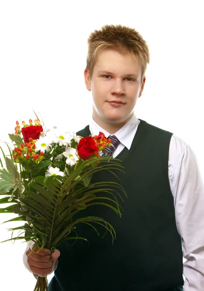 Uczeń w mundurek szkolny z bukietem kwiatów — Zdjęcie stockowe