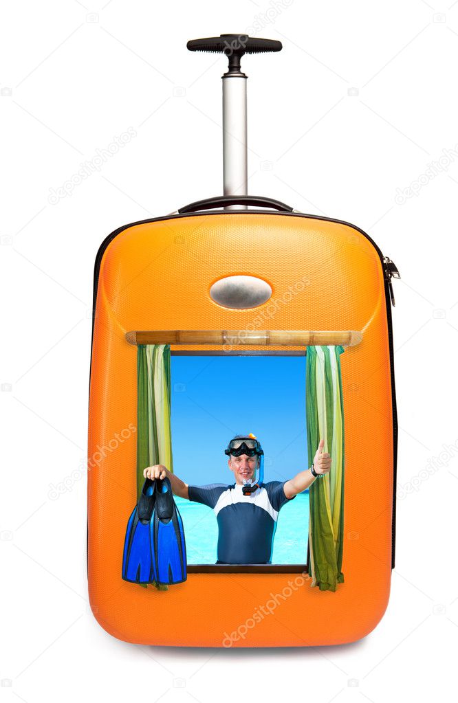 The man in a road suitcase on background of ocean shows sign OK