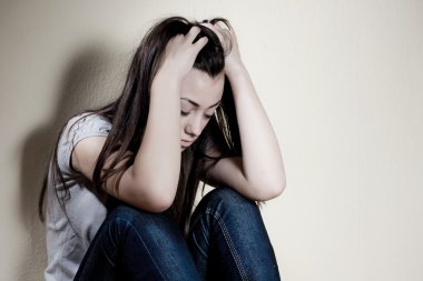 Closeup portrait of depressed teenager girl. clipart