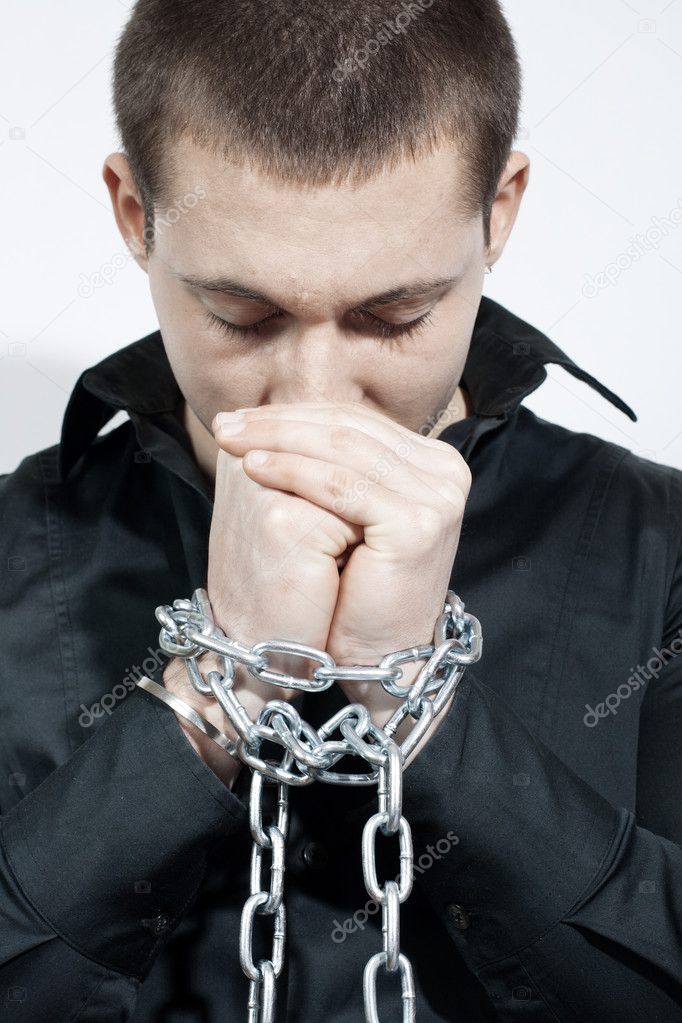 Man with a chained hands.