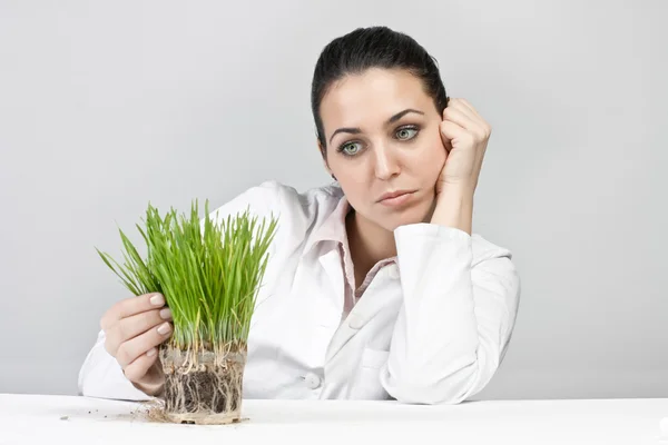 Worried Girl Watching Plant Grow — Stock Photo, Image