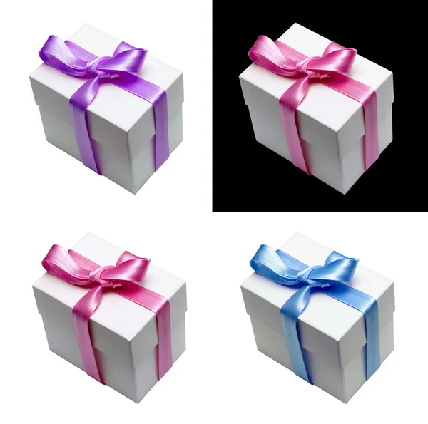 礼品盒与四个不同颜色的缎带绑 — 图库照片