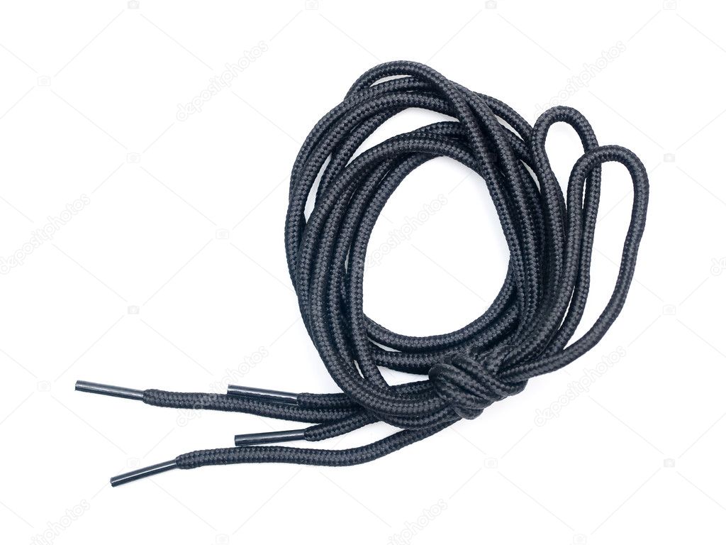 Long black shoelace tied in a knot isolated on white