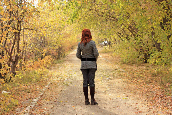 The girl in autumn park