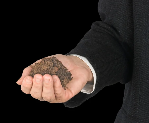 Hand with soil — Stock Photo, Image
