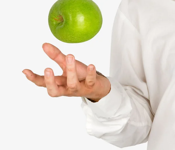 Apple falling to hand — Stock Photo, Image