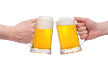 Hands with mugs of beer