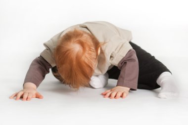 Child Laying On White Floor clipart