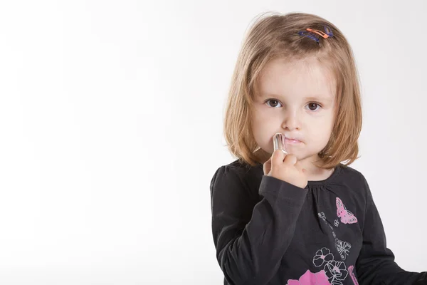 Little girl with lipstick — Stock Photo, Image