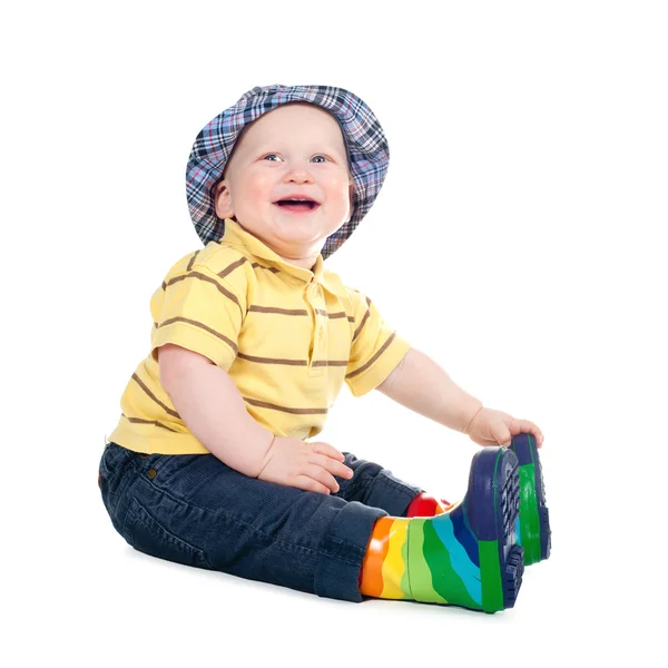 Pequeño chico divertido en botas de goma aisladas —  Fotos de Stock