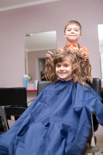 Boy and girl in barbershop — Stock Photo, Image