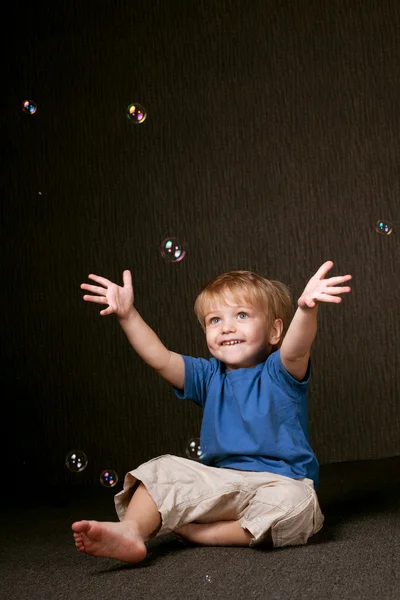 Little Happy Boy Plays Bubbles Stock Photo