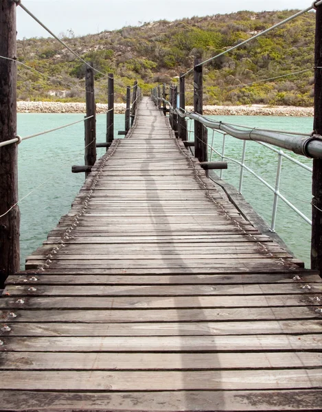 stock image Wooden Suspension bridge over a lagoon