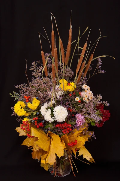 stock image Bouquet from autumn colours, yellow leaves, guelder-rose fruits