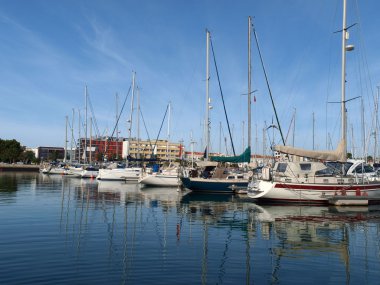 The yacht harbor full of beautiful boats on the coast of the Algarve clipart