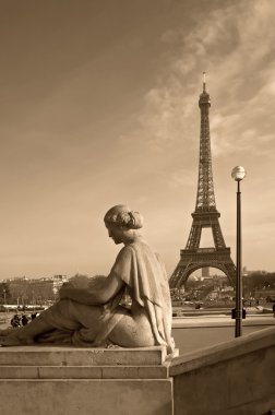 Eiffel tower with a woman's sculpture (Paris, France) clipart