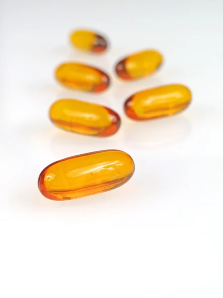Yellow pills isolated on white — Stock Photo, Image