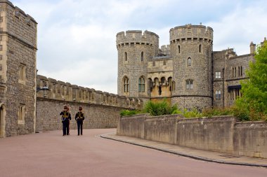 Queen's Guard soldiers marching in Windsor Castle, The United Kingdom clipart