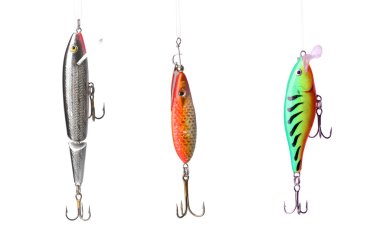 Five fishing lures -floating wobblers hanging in front of white background clipart